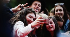Lorde takes a selfie with fans at New Zealand musi