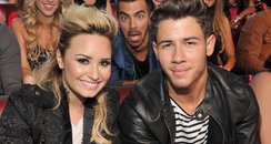 Nick Jonas and Demi Lovato Photobomb