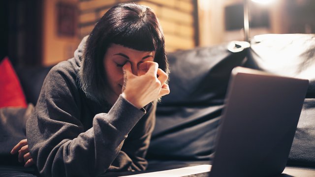 Woman at a computer in frustration 