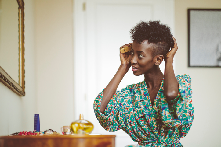 Woman combing through her hair 