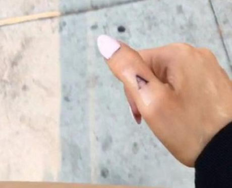 Ariana Grande's 'A' thumb tattoo