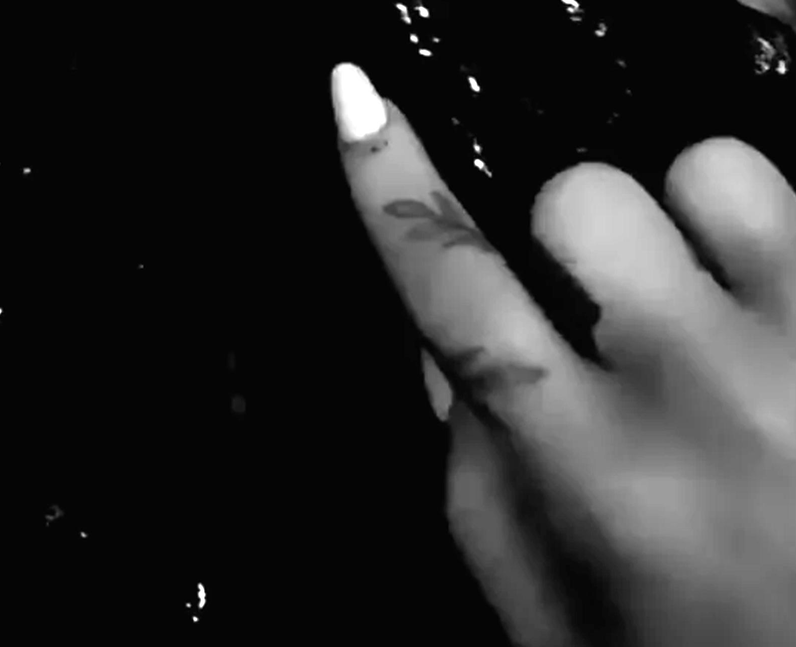 Ariana Grande vine tattoo left index finger